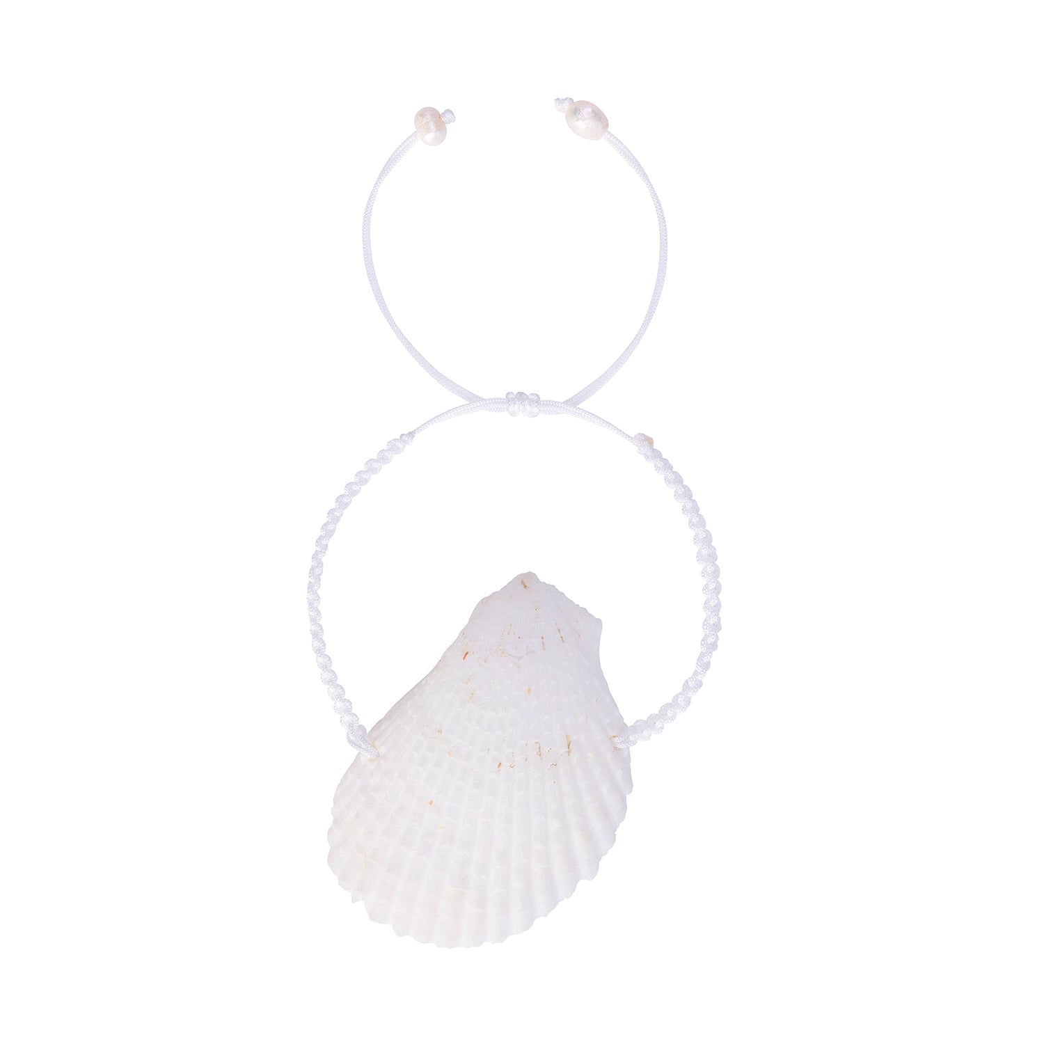 Overhead view of the handcrafted white scallop shell bracelet, highlighting the intricate braiding and the shell's organic texture.