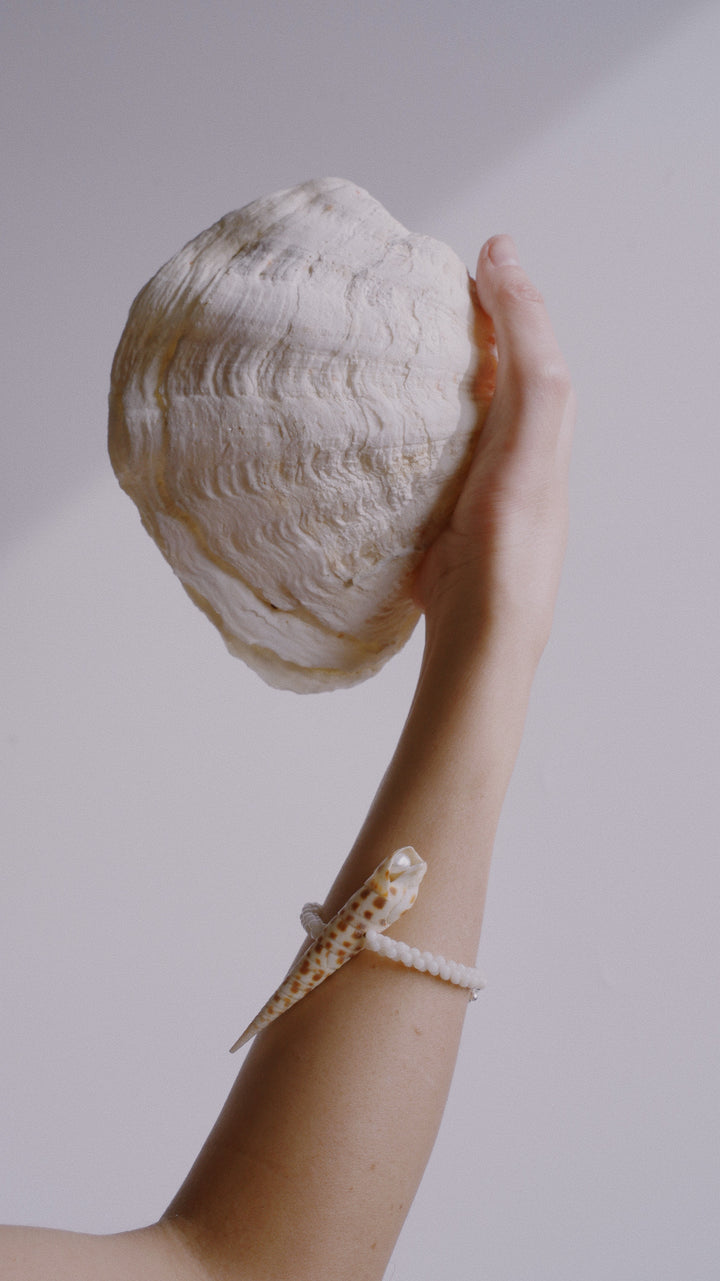 A close-up image of a person's wrist wearing the Solete Bracelet.