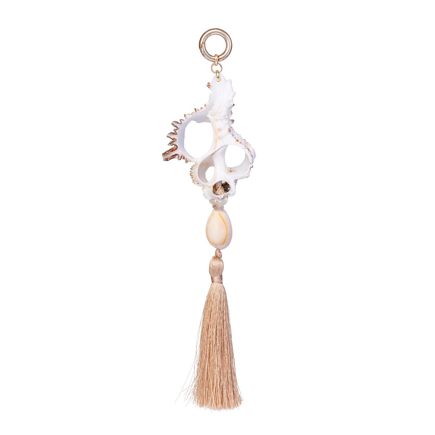 Handmade shell fob featuring a white cut murex shell, a small cowrie, and a beige cotton tassel on a gold-toned ring against a white background.