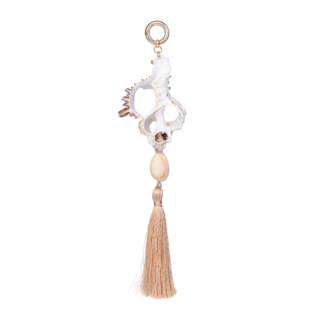 Handmade shell fob featuring a white cut murex shell, a small cowrie, and a beige cotton tassel on a gold-toned ring against a white background.