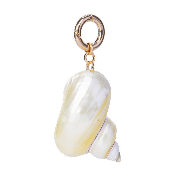 Handcrafted natural spiral pearl turbo shell charm, attached to a gold-toned spring ring clasp against a white background.