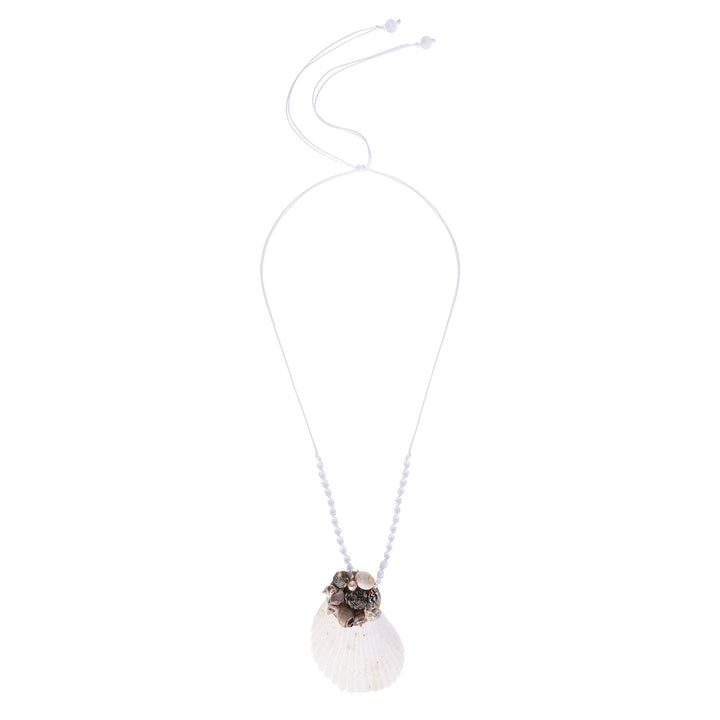 Handcrafted white shell necklace featuring a large scallop pendant decorated with a cluster of small shells and a pearl, suspended on a beaded moonstone and cotton cord.