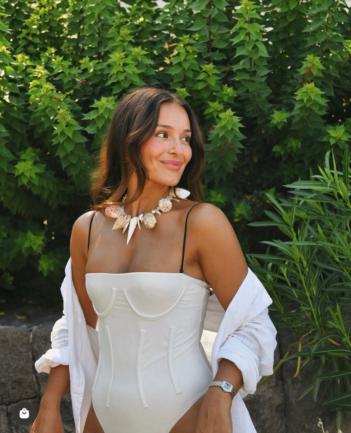 Lifestyle styling of the Azurece Neckpiece worn as a sophisticated coastal statement piece.