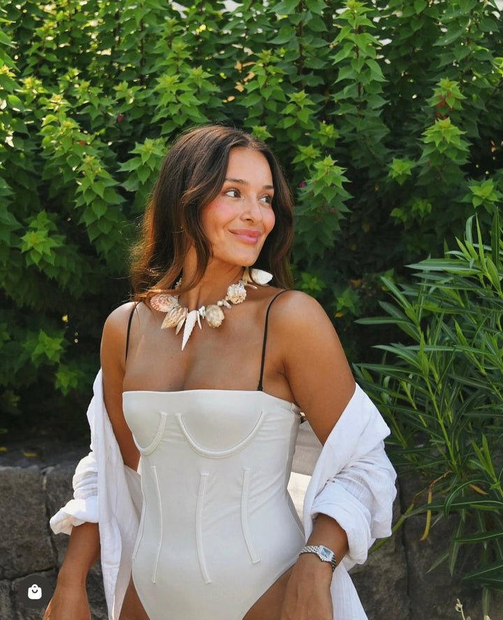 Lifestyle styling of the Azurece Neckpiece worn as a sophisticated coastal statement piece.