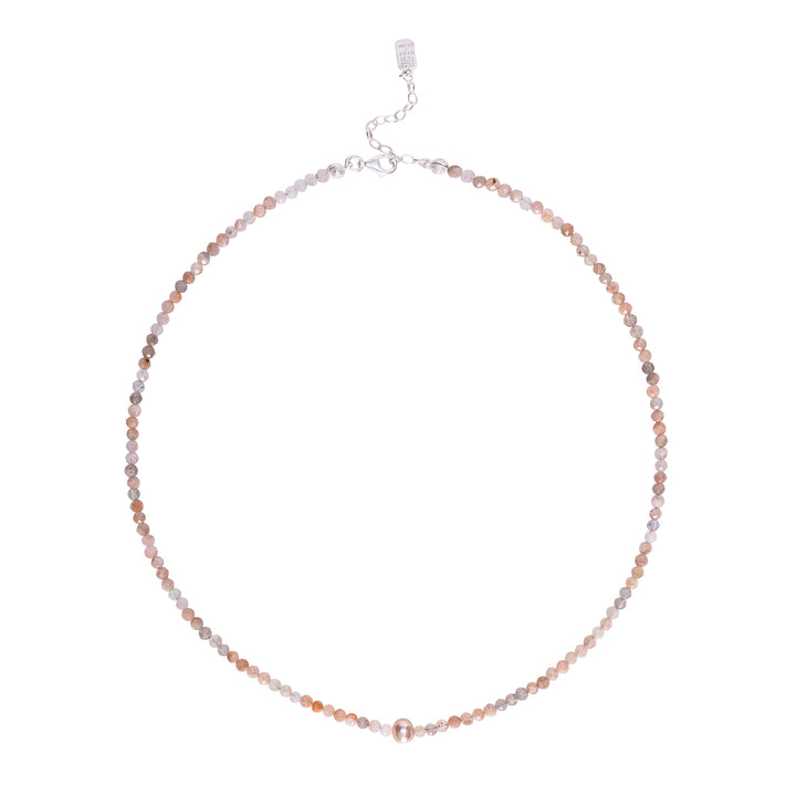 Handcrafted necklace featuring faceted sunstone beads and a central pearl accent with a silver clasp.