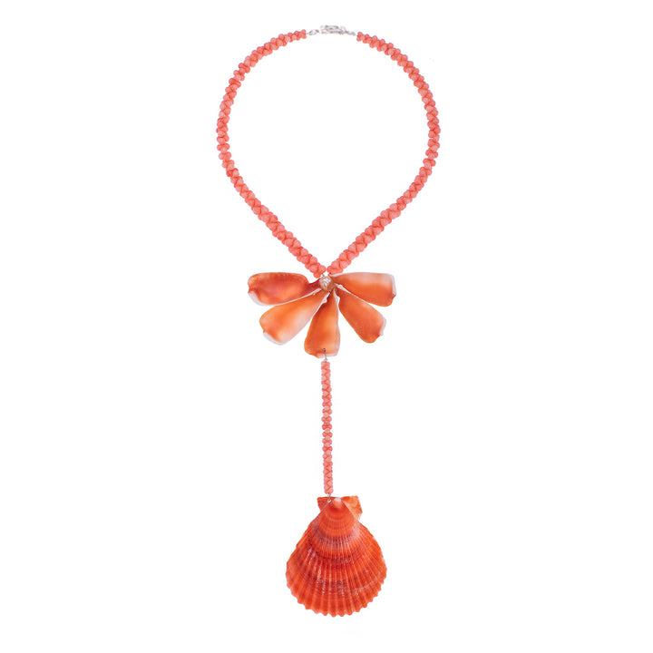 A red and orange beaded necklace with a floral design made from sea shells and a pearl.