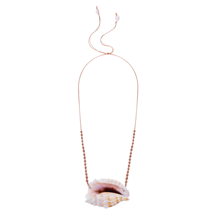 Front view of the Cowrie Helmut Neckpiece featuring a natural helmet shell pendant with a pearl accent on a hand-knotted silk cord.