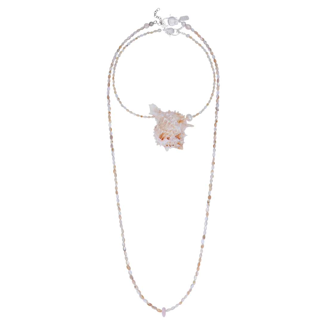 A display of two necklaces: a short statement piece with a large murex shell and pearl pendant, and a longer, simple mother-of-pearl heishi bead strand.