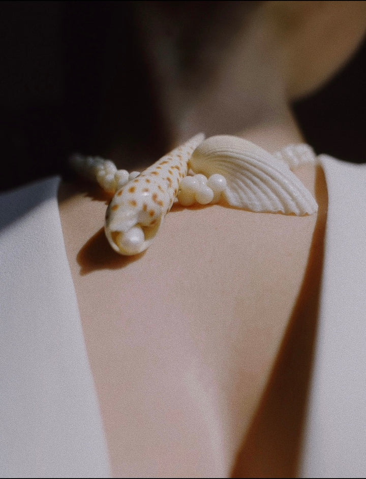 A close up of the Solete Neckpiece featured on a model