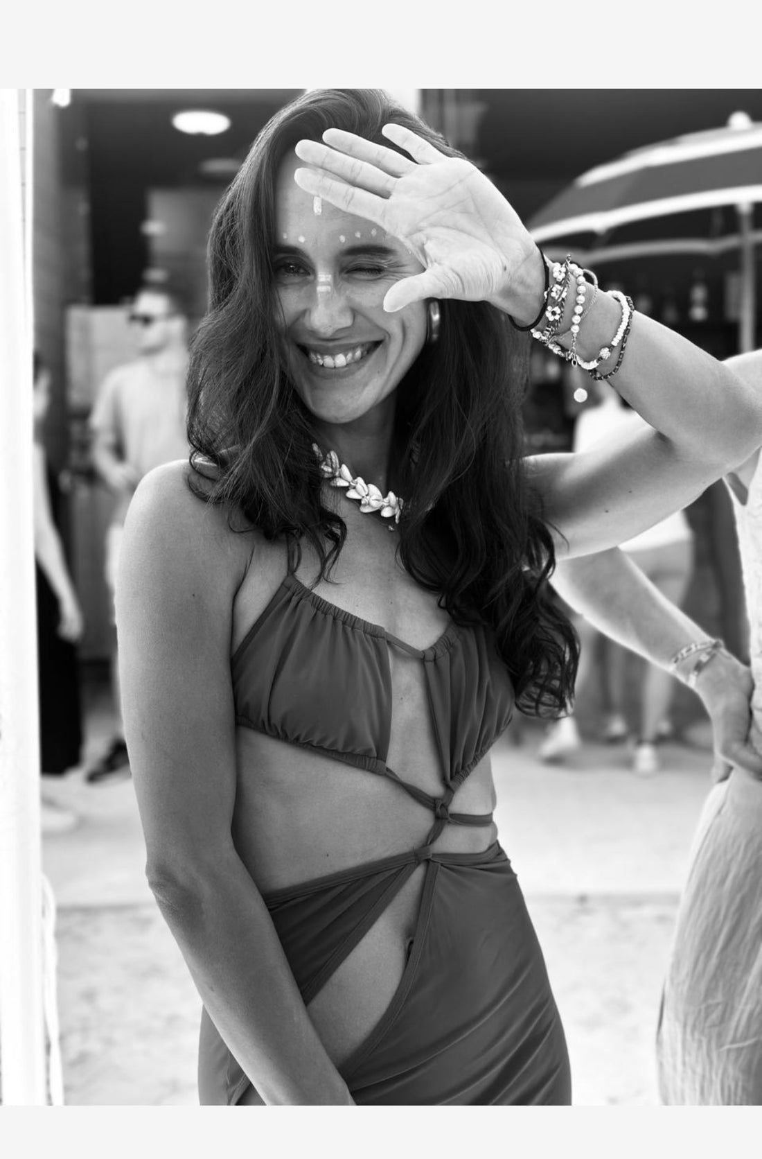 Cowrie shell necklace on a model in a lifestyle image