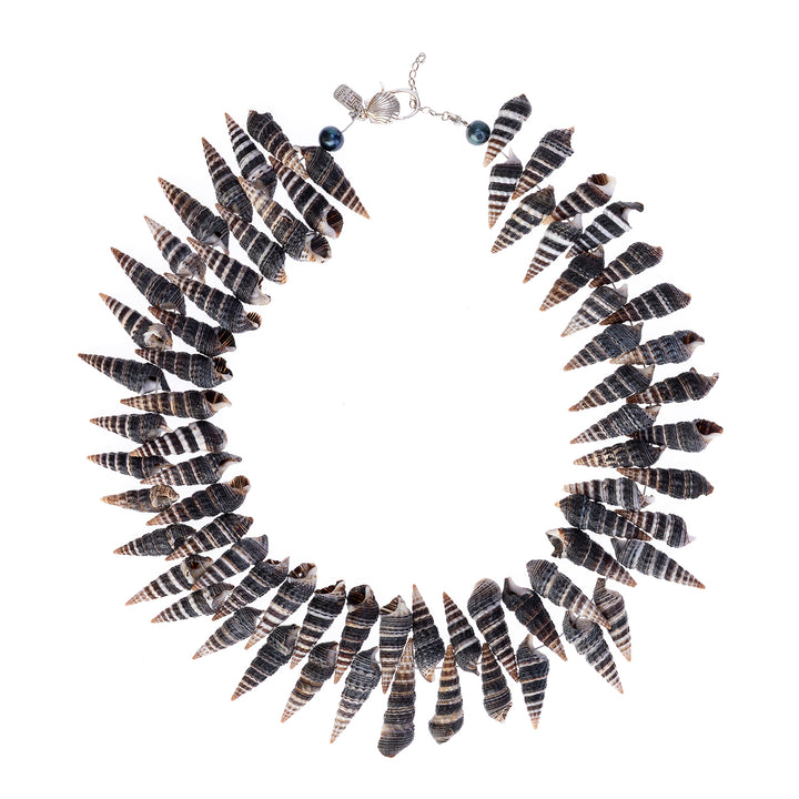 Handcrafted necklace featuring black and white striped spiral shells, accented with black pearls, onyx and a 925 sterling silver clasp.