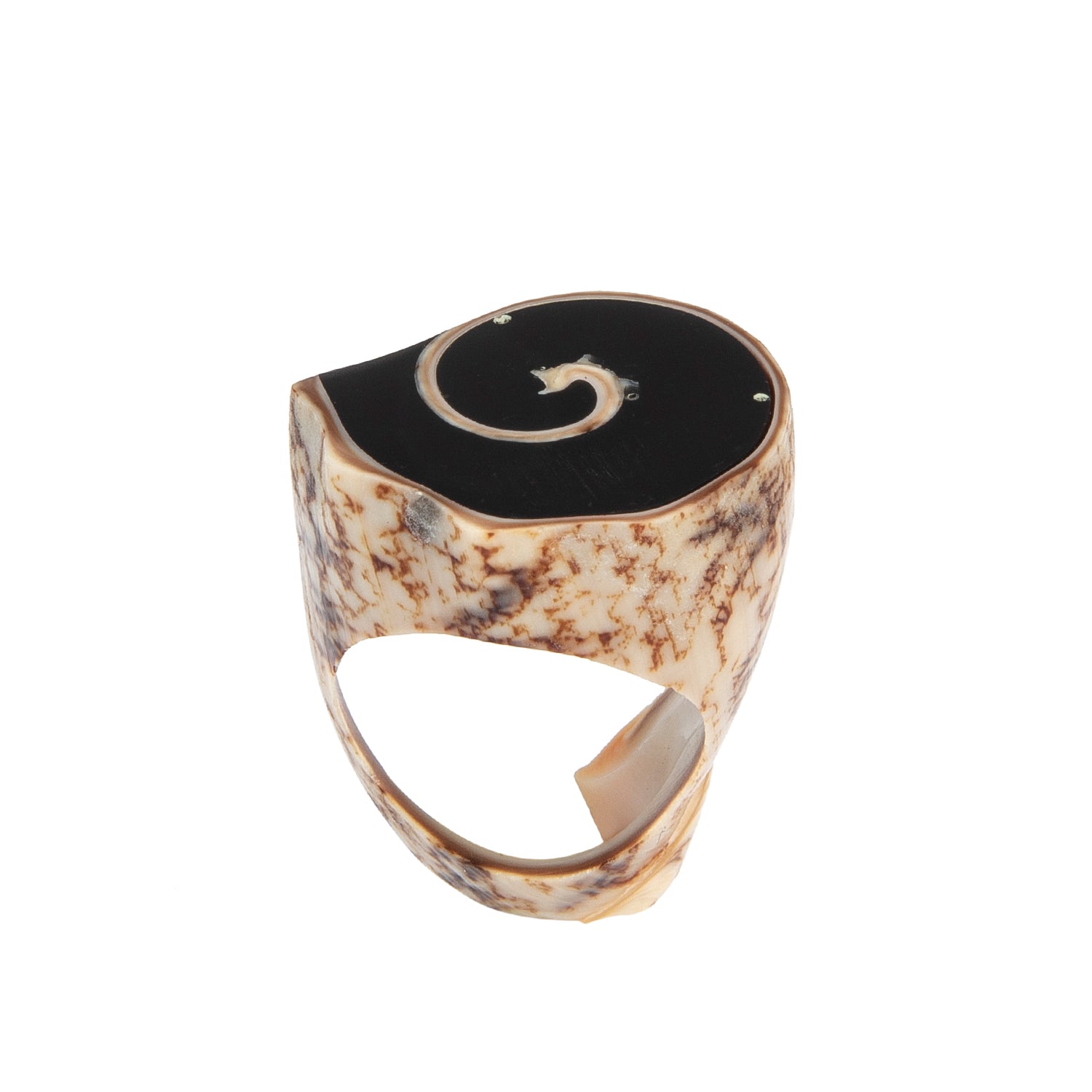 A hand-carved seashell ring set with a semi-precious stone.