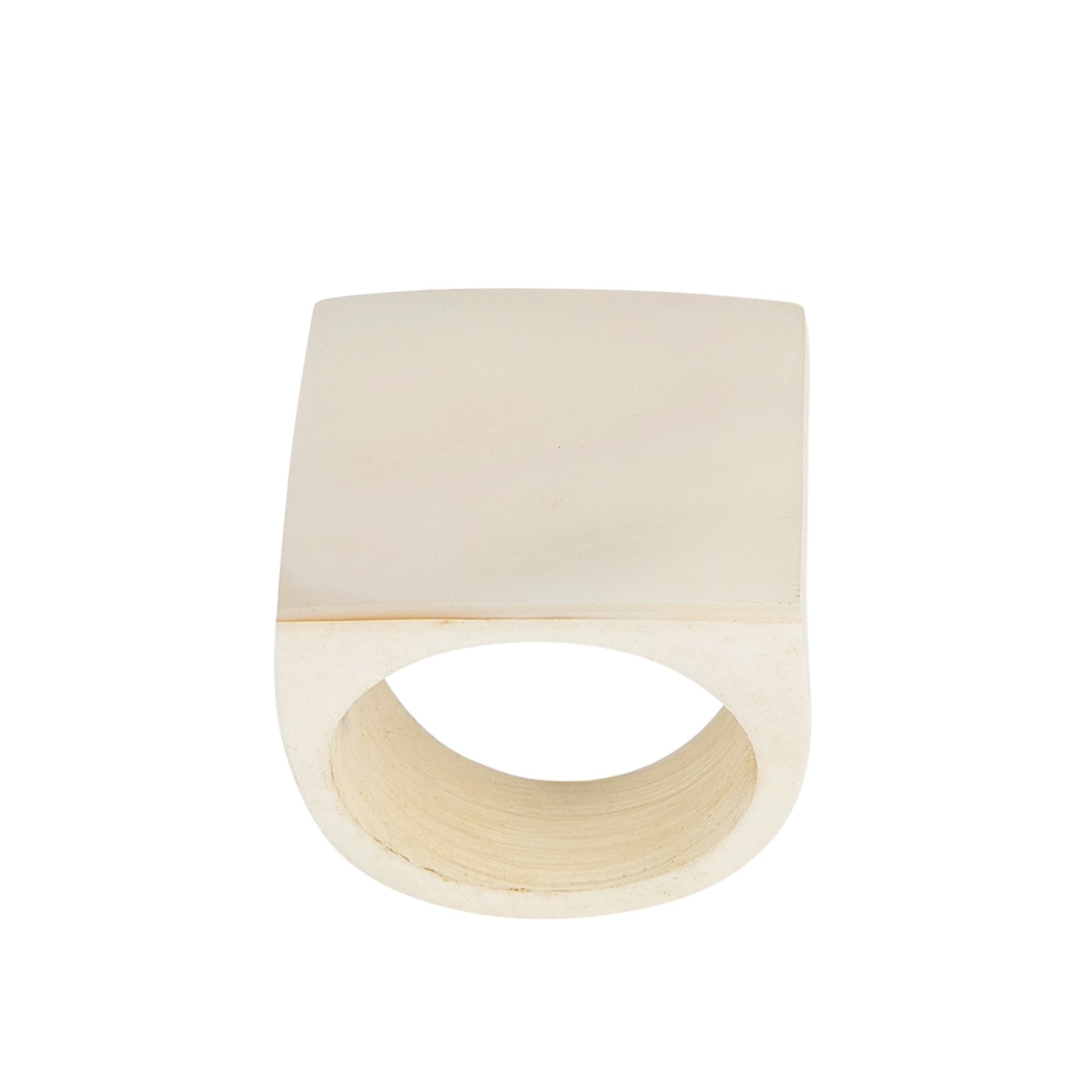 A hand-carved seashell ring made with semi-precious stones.