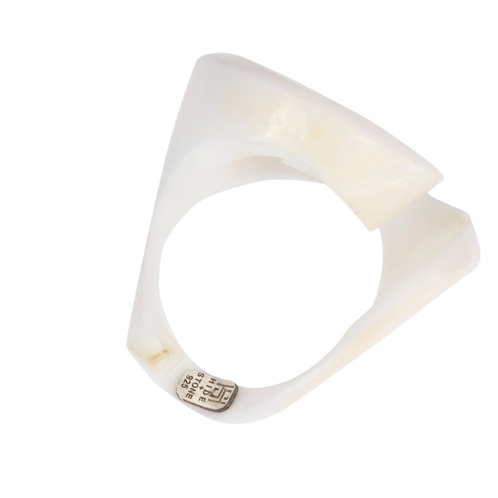 A hand-carved seashell ring made with semi-precious stones.