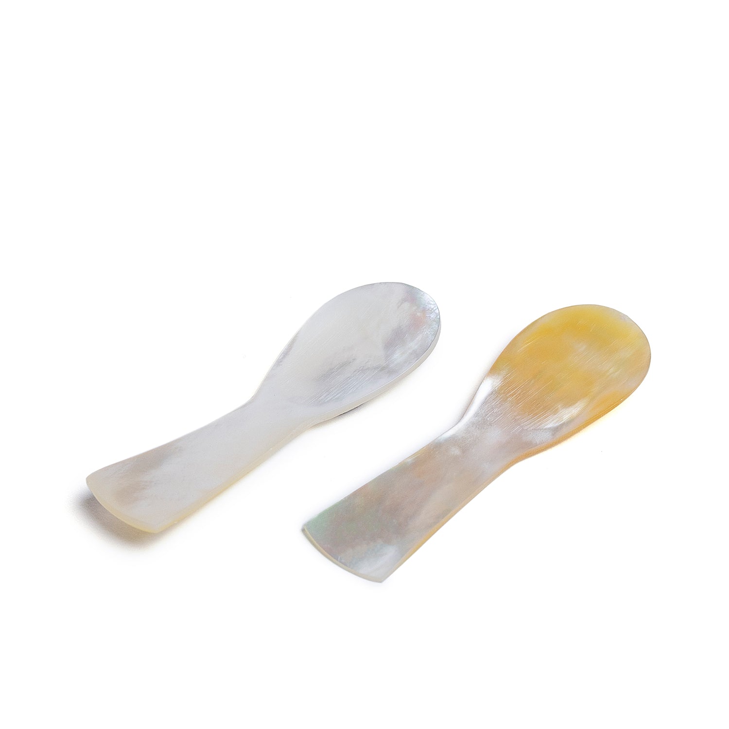2 spoons handcrafted from luminous pearl shell.