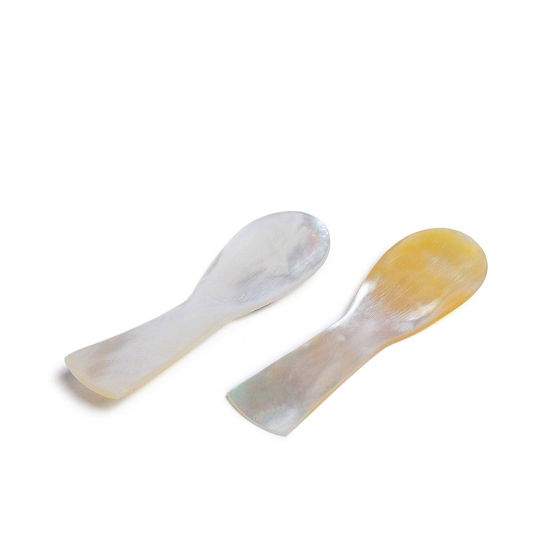 2 spoons handcrafted from luminous pearl shell.